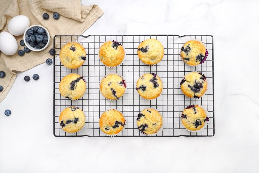 Easy blueberry muffin recipe on cooling rack.