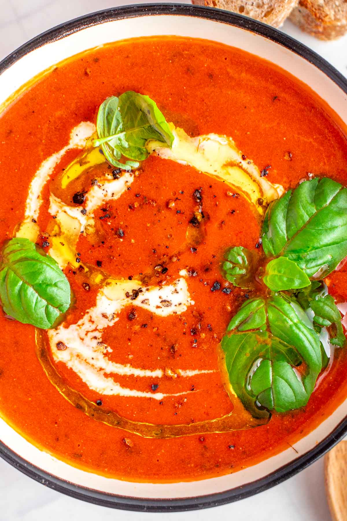 Easy Tomato Soup recipe with swirl of cream.