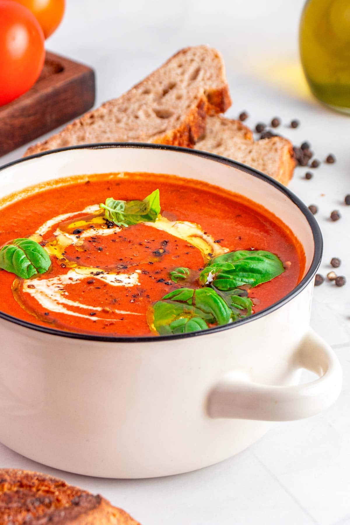 Easy Tomato Soup recipe with bread on the side.