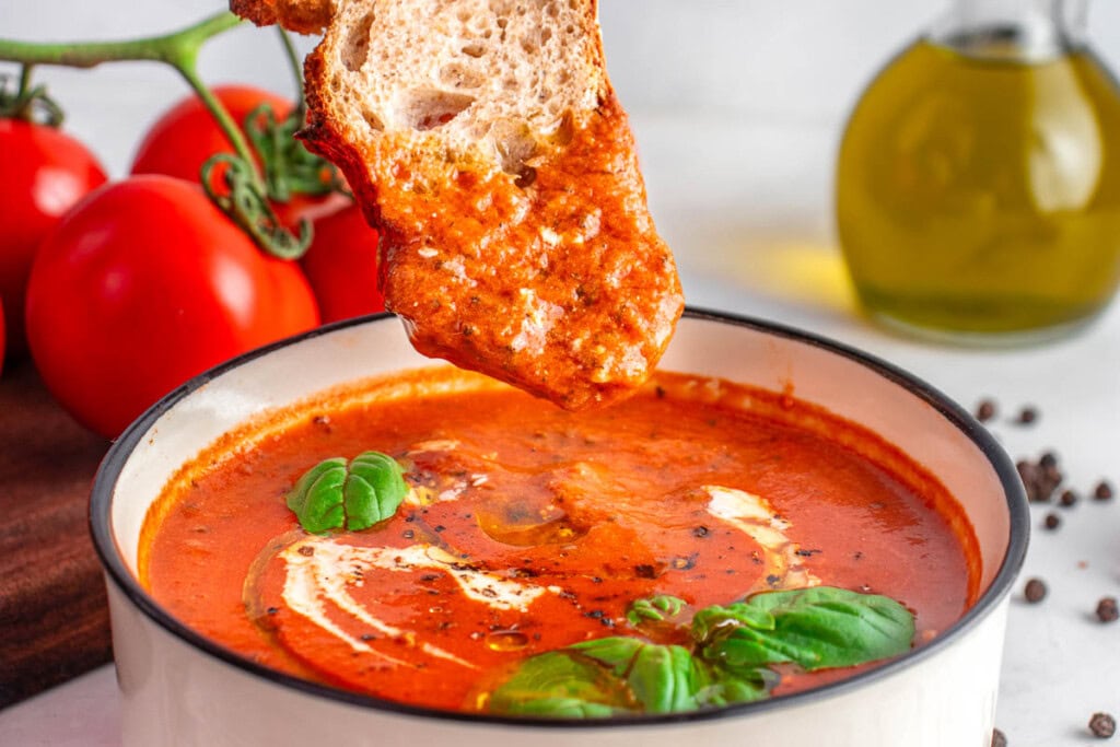 Bread dipped into Easy Tomato Soup.