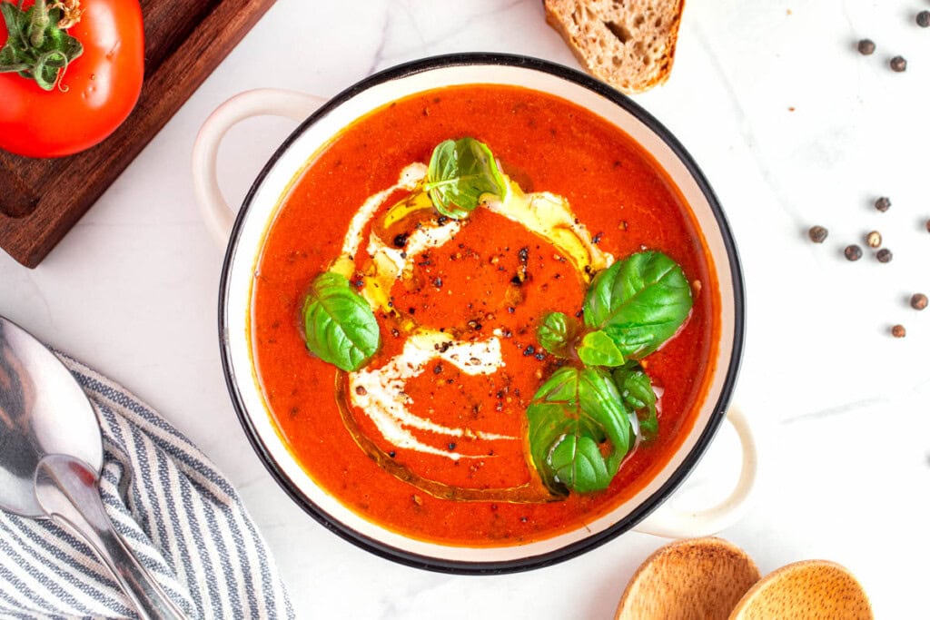 Easy Tomato Soup recipe garnished in bowl.