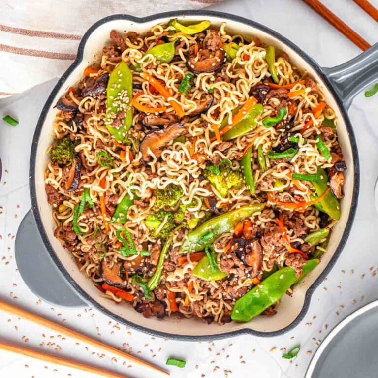 Ground Beef Stir Fry, aerial view in skillet with chopsticks on table.