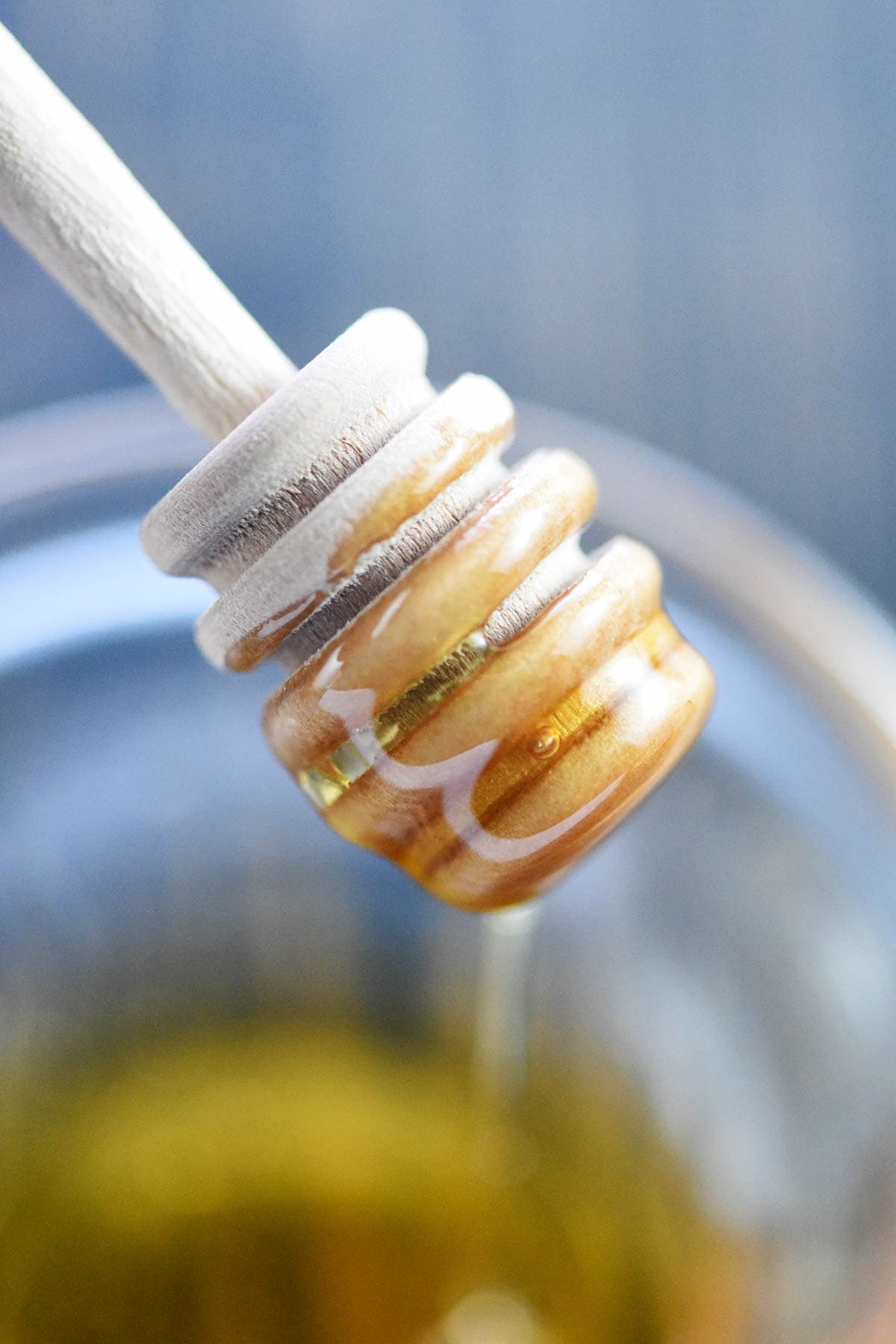 Honey drizzling into bowl for Honey Mustard Dipping Sauce.