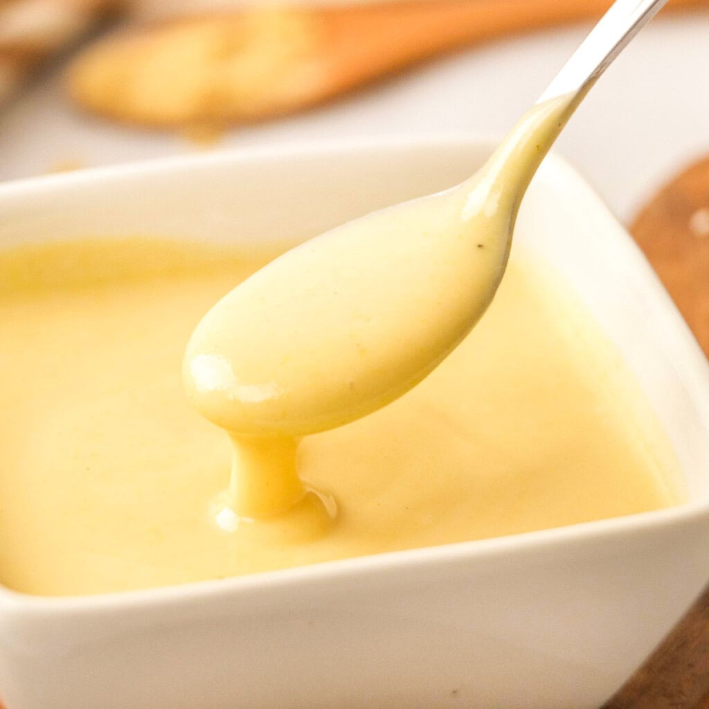 Honey Mustard Dipping Sauce in bowl with spoon.