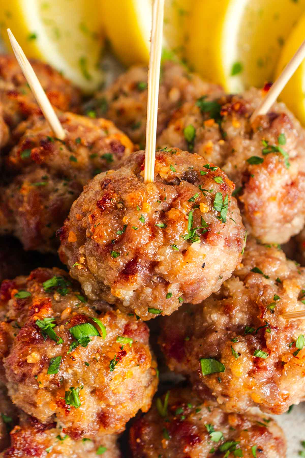 Turkey meatballs baked and speared with toothpicks.