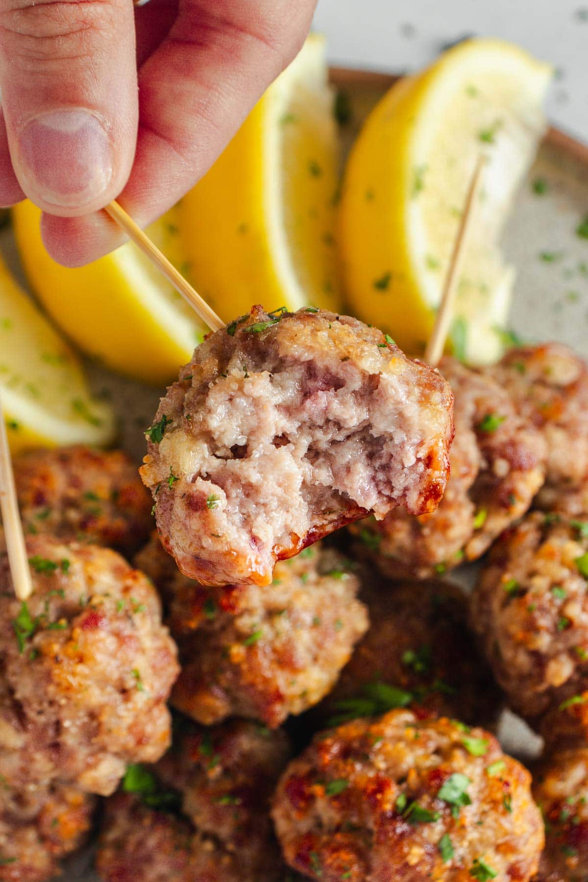 Baked Turkey Meatballs with missing bite.