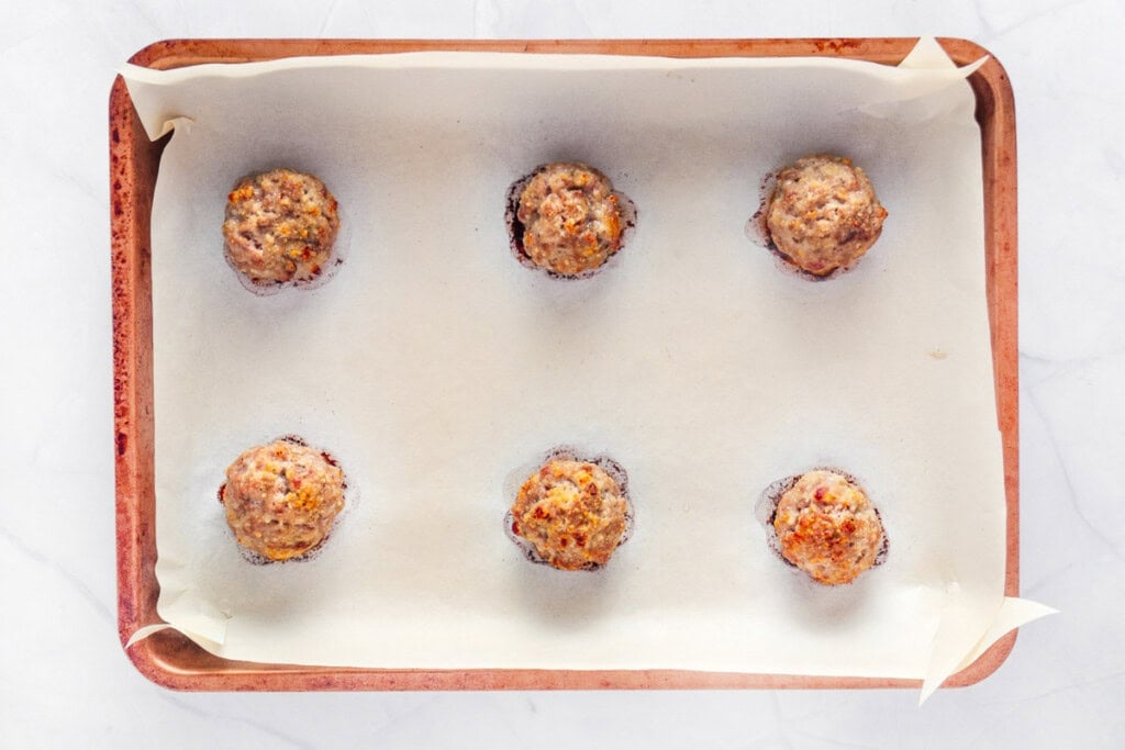 Turkey meatballs baked on pan.