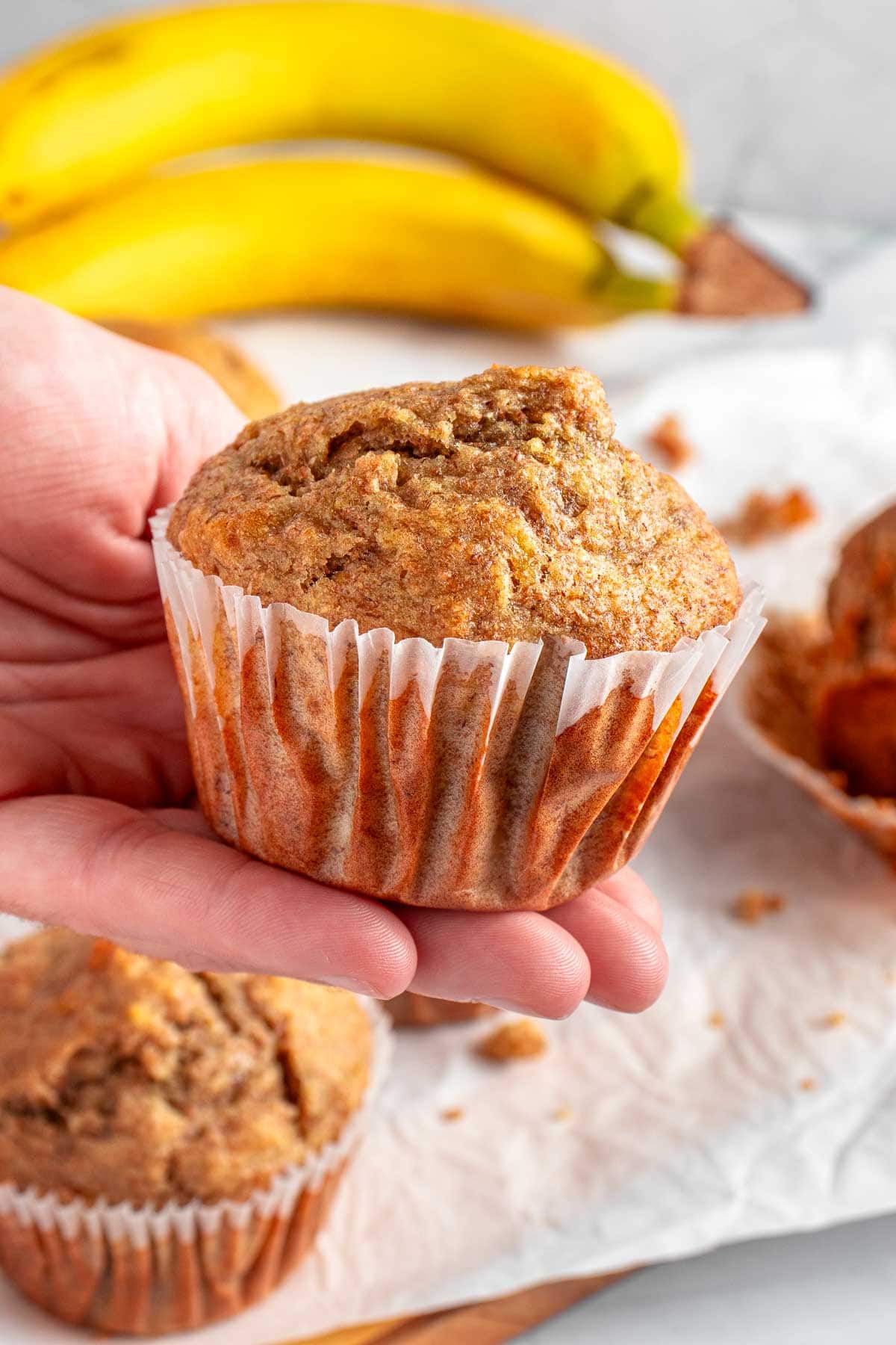 Healthy Banana Muffins in hand.