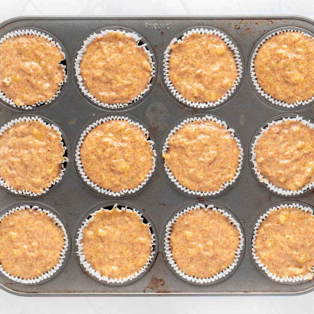 Healthy banana muffins recipe in pan ready for oven.