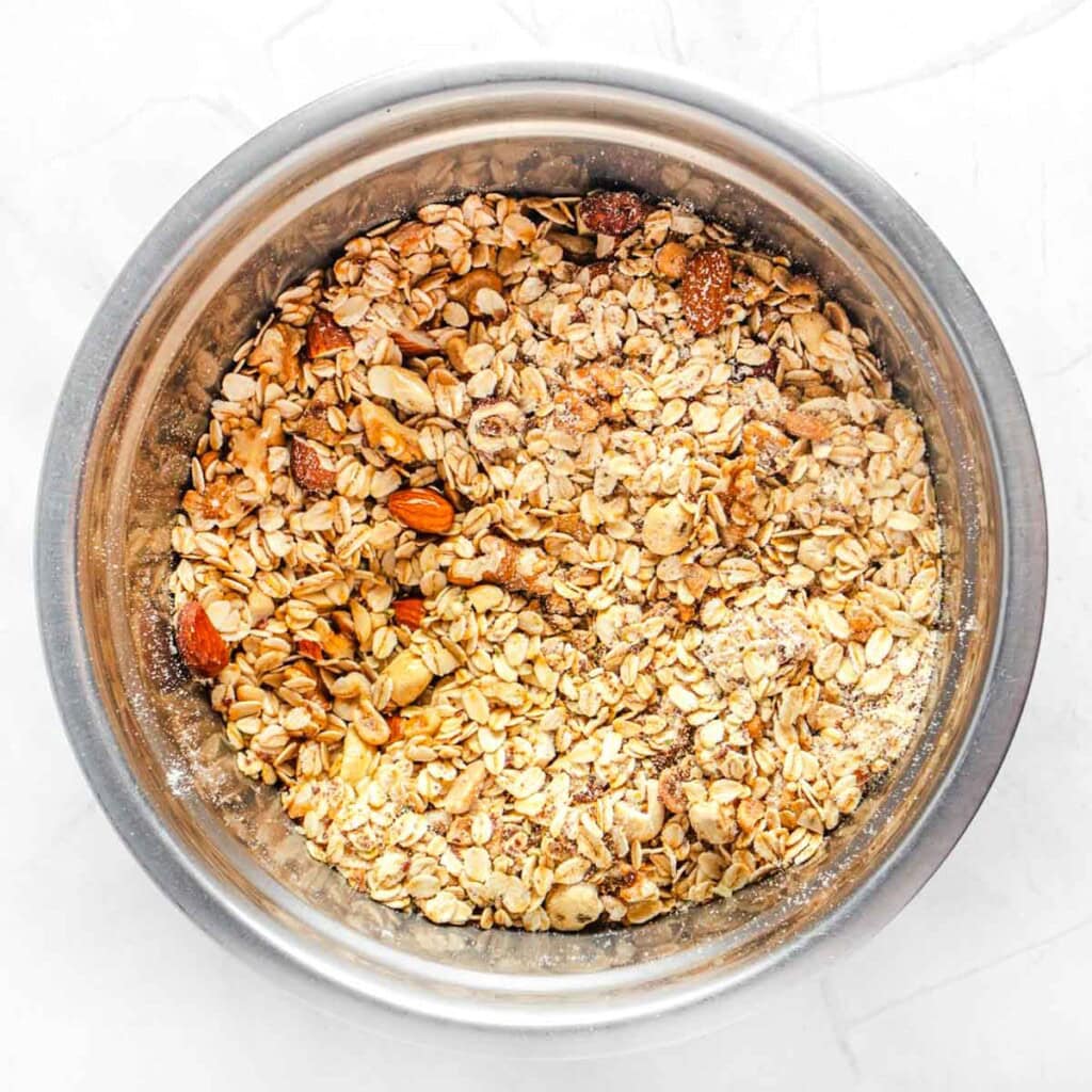 Adding oil to Protein Granola recipe.