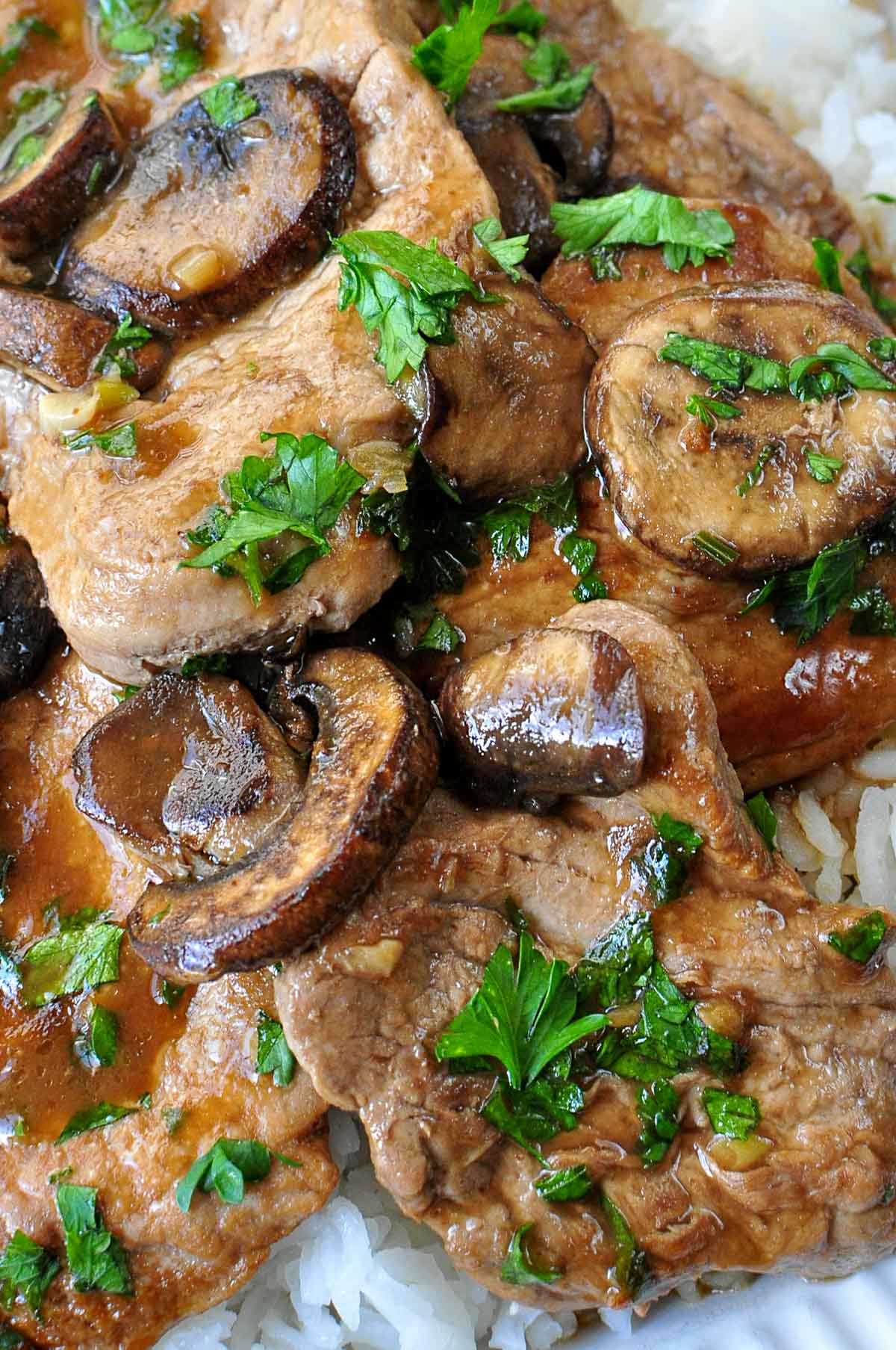 Pork Tenderloin Medallions with mushroom gravy close-up.