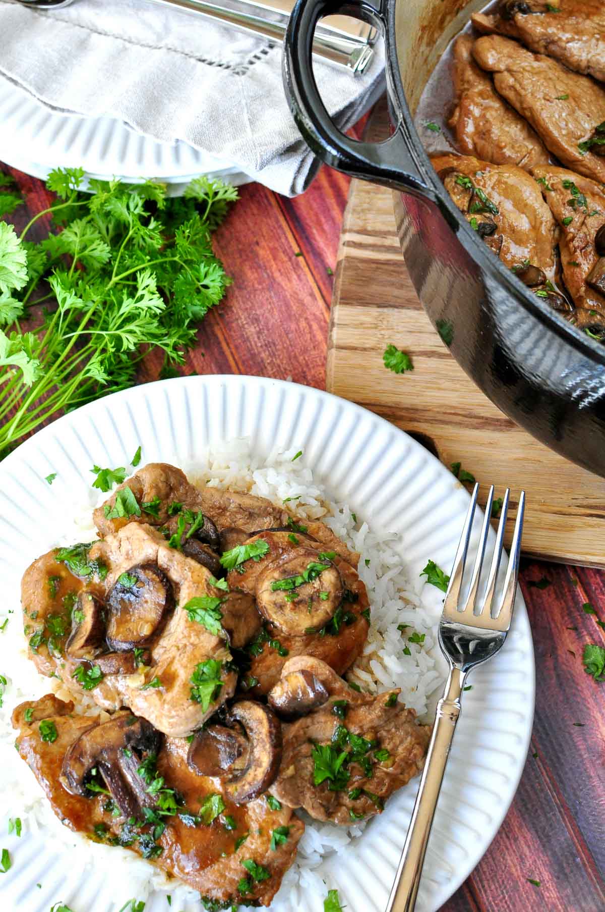 Aerial view of Pork Tenderloin Medallions on plate and in pot.