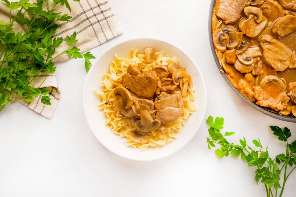 Pork Tenderloin Medallions and mushrooms over egg noodles.