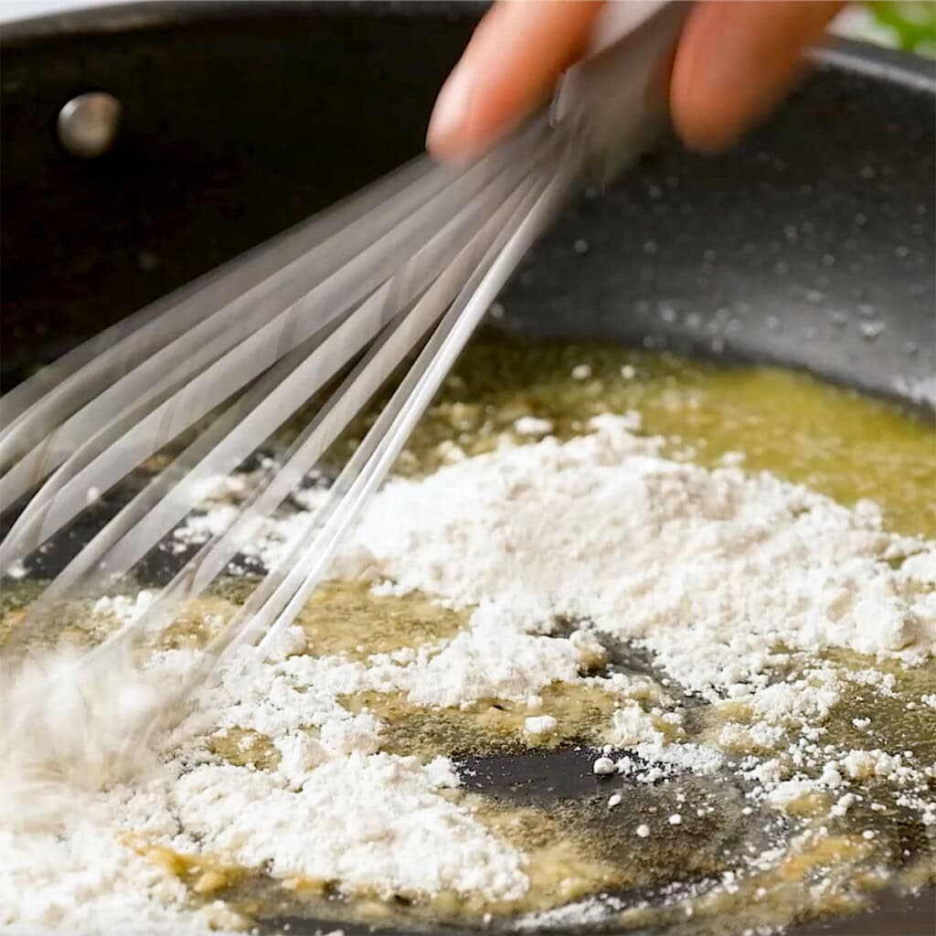 Whisking flour into butter.