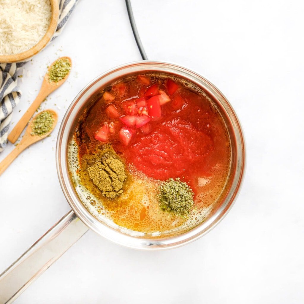 How to make Spanish rice with chicken broth, tomato sauce, and Spanish rice seasoning.