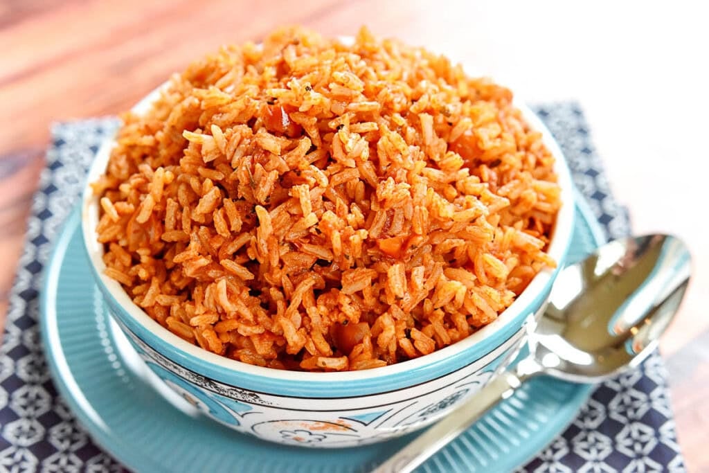 Spanish rice in blue and white bowl.