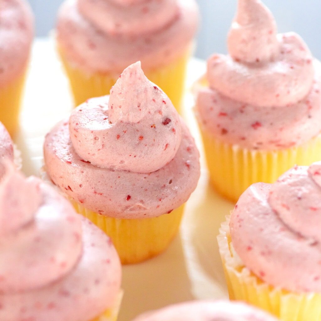 Strawberry Cream Cheese Frosting on vanilla cupcakes.