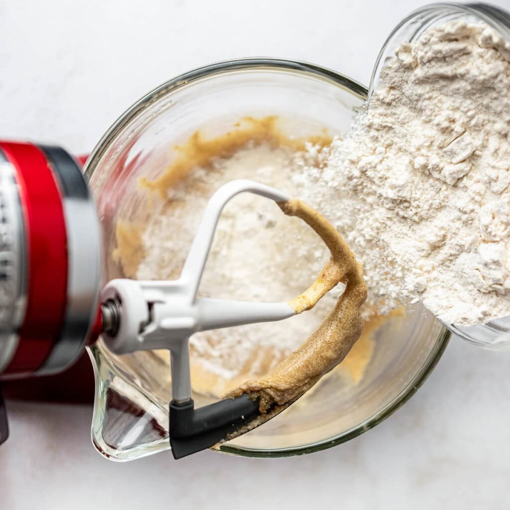 Adding flour mixture to batter.